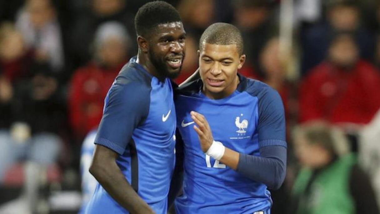 Samuel Umtiti et Kylian Mbappé, joueurs français d'origine camerounaise.